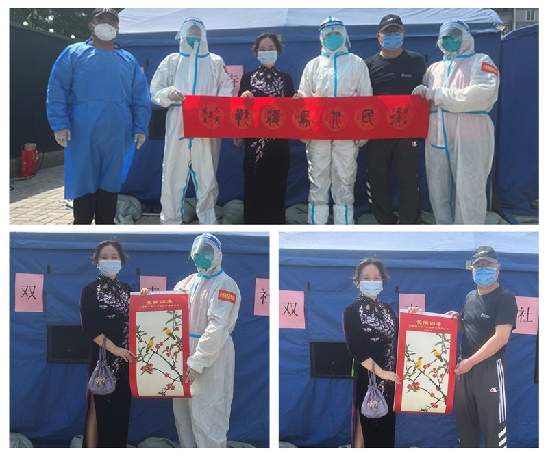 姚梅梅向双寺社区核酸检测点赠送文化锦旗和美育教材_副本.jpg